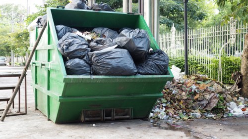 Professional team planning waste removal at a construction site